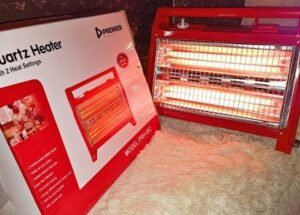 Premier 1200W portable quartz electric heater with two heat settings for home and office use.