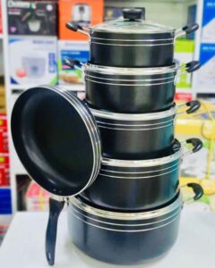 10-piece non-stick aluminium cookware set with deep cooking pots, frying pan, and tempered glass lid.